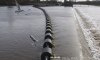 black traffic control booms in the waterway thumbnail