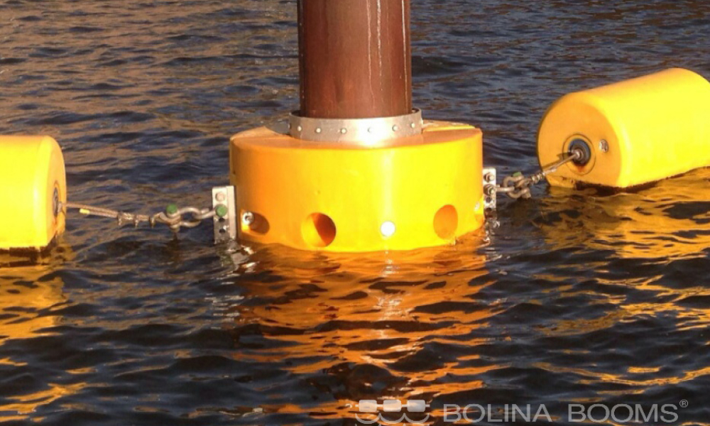 close view of yellow port security boom in the water